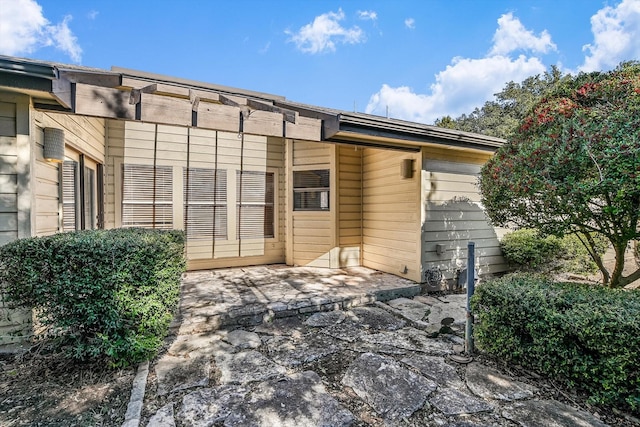 rear view of house with a patio