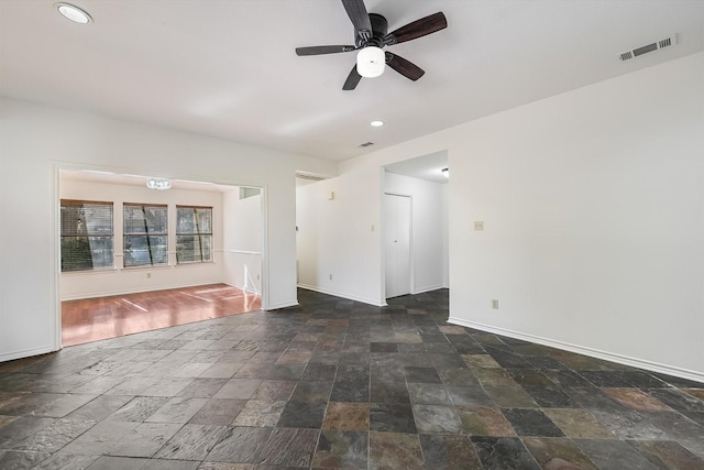 unfurnished room with ceiling fan