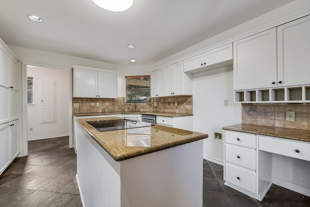 kitchen featuring black electric cooktop, dark stone counters, white cabinets, and a kitchen island