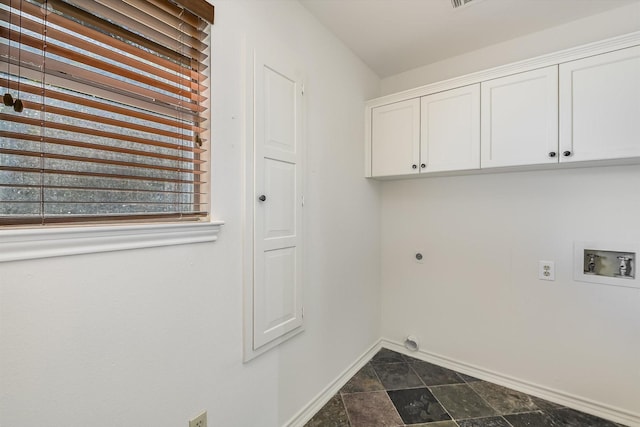 clothes washing area with hookup for a washing machine, cabinets, and hookup for an electric dryer