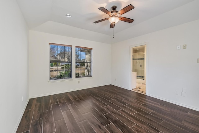 unfurnished room featuring a raised ceiling and ceiling fan