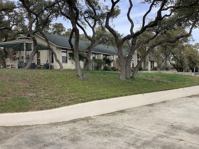 view of front of property with a playground and a front yard