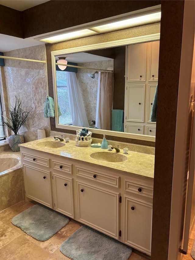 bathroom with independent shower and bath, vanity, and tile patterned flooring