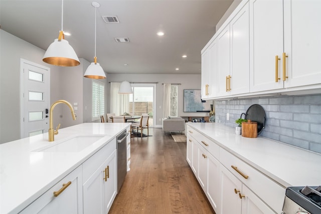 kitchen with white cabinetry, pendant lighting, dishwasher, and sink