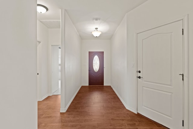 entryway with hardwood / wood-style flooring