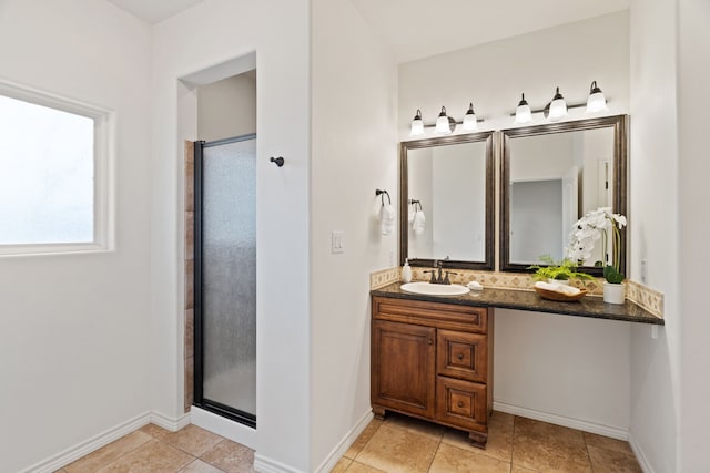 bathroom featuring tile patterned flooring, a shower with door, and vanity