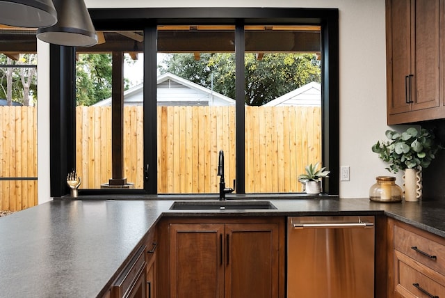 1808 Riverview St Unit B, Austin, TX 78702 - kitchen with a sink, stainless steel dishwasher, and dark countertops