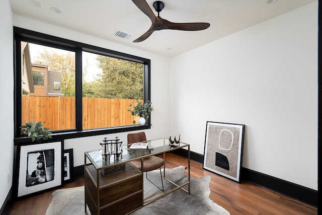 office featuring dark wood-type flooring and ceiling fan