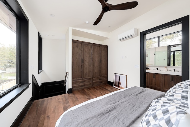 bedroom with ceiling fan, lofted ceiling, dark wood-type flooring, and a wall mounted air conditioner