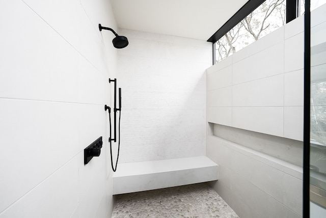 bathroom with a tile shower