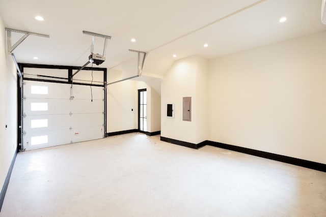 1808 Riverview St Unit B, Austin, TX 78702 - garage with electric panel, a garage door opener, recessed lighting, and baseboards