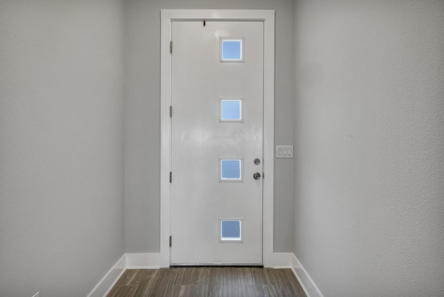 doorway with wood-type flooring