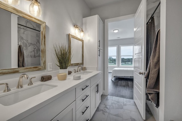 bathroom with walk in shower and vanity