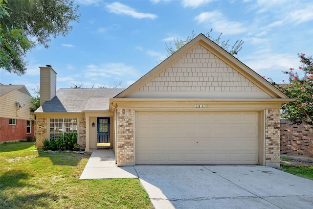 view of front of house with a front yard, central AC unit, and a garage