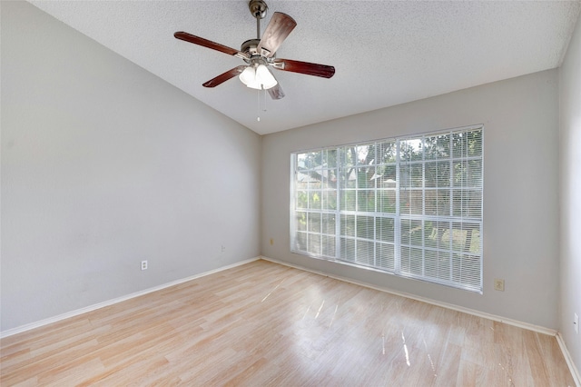 spare room featuring ceiling fan, a textured ceiling, and light hardwood / wood-style floors