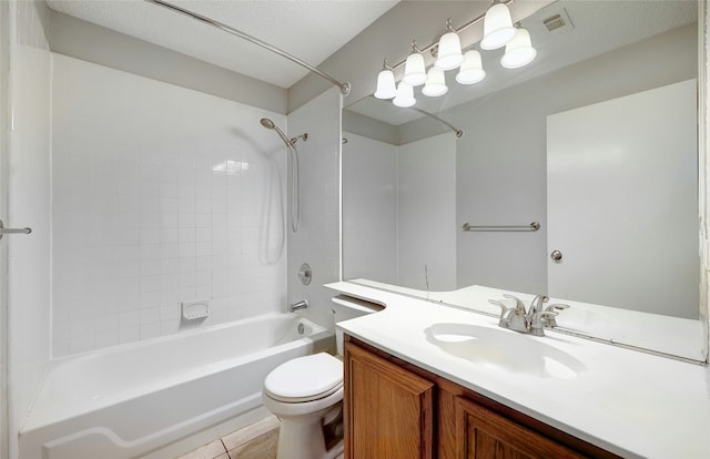 full bathroom with toilet, vanity, tiled shower / bath combo, and tile patterned flooring