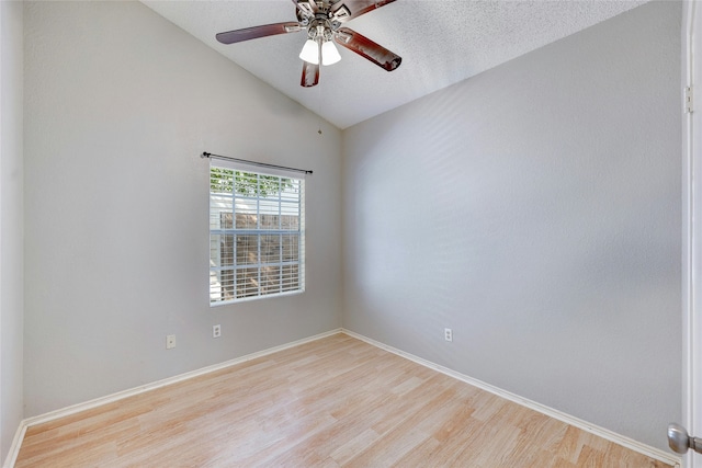 unfurnished room with lofted ceiling, ceiling fan, a textured ceiling, and light hardwood / wood-style flooring