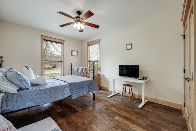 bedroom featuring ceiling fan and dark wood-type flooring