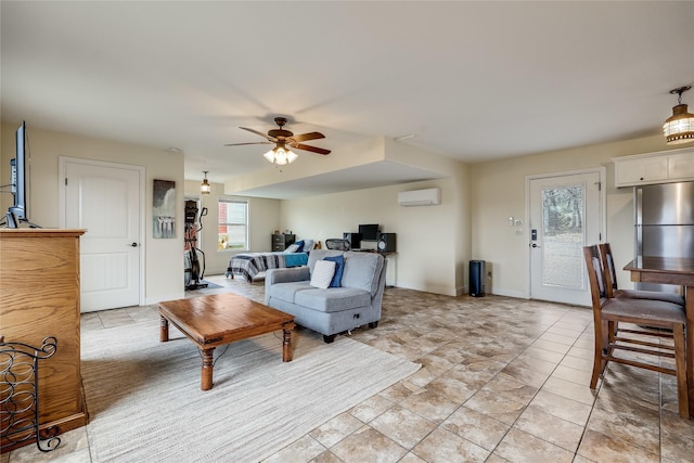 living room featuring ceiling fan, light tile patterned floors, and a wall mounted air conditioner