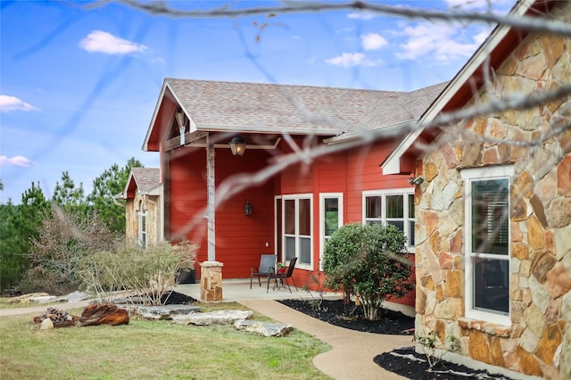 exterior space with a patio area and a yard