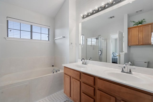 full bathroom with a shower stall, a garden tub, vaulted ceiling, double vanity, and toilet