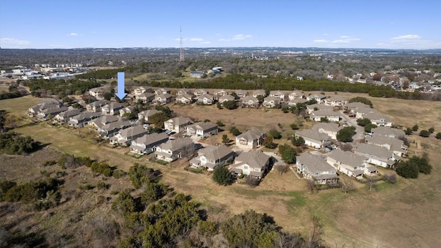 aerial view of property's location with nearby suburban area