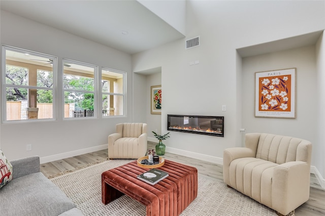 living room with light hardwood / wood-style flooring