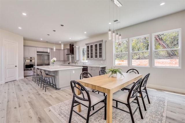 dining room with light hardwood / wood-style flooring