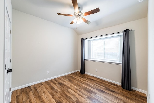 spare room with ceiling fan, lofted ceiling, and hardwood / wood-style floors