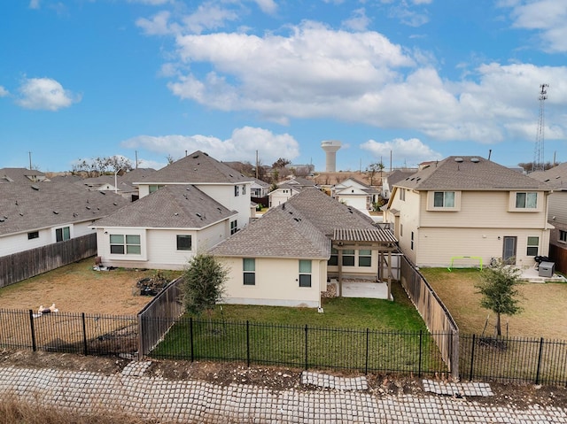 back of property featuring a lawn