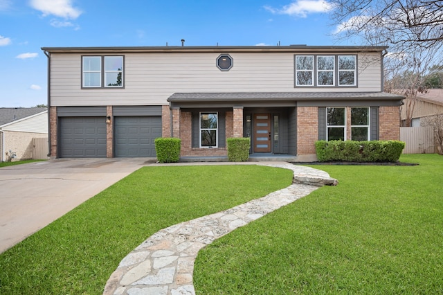 view of front of property featuring a front lawn and a garage