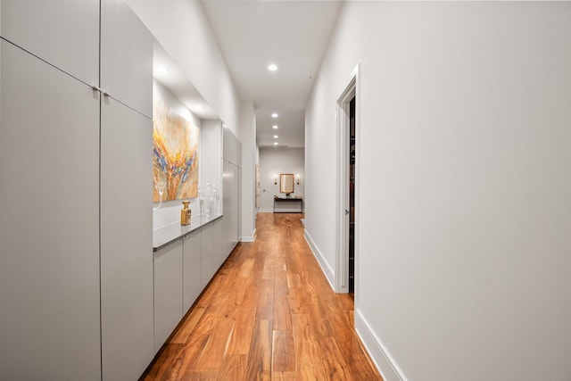 corridor with light hardwood / wood-style flooring