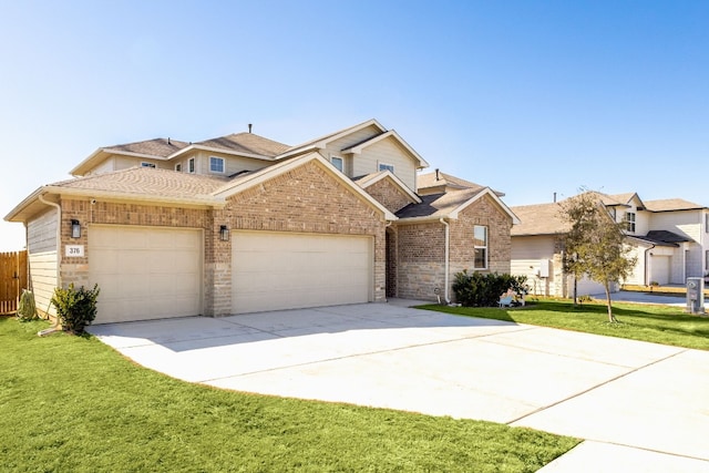 376 Spider Lily Dr, Kyle, TX 78640 - traditional home featuring an attached garage, concrete driveway, brick siding, and a shingled roof