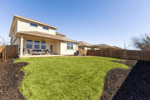 rear view of house featuring central AC unit, a patio area, ceiling fan, and a lawn