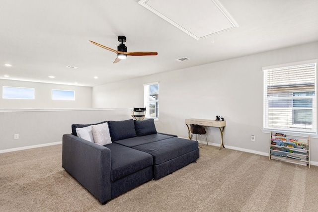 carpeted living room featuring a healthy amount of sunlight