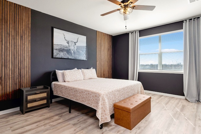 bedroom featuring ceiling fan and light hardwood / wood-style flooring