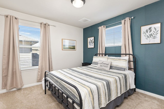 376 Spider Lily Dr, Kyle, TX 78640 - bedroom featuring carpet floors, multiple windows, and baseboards