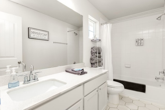 376 Spider Lily Dr, Kyle, TX 78640 - bathroom with vanity, shower / tub combo with curtain, toilet, and tile patterned flooring