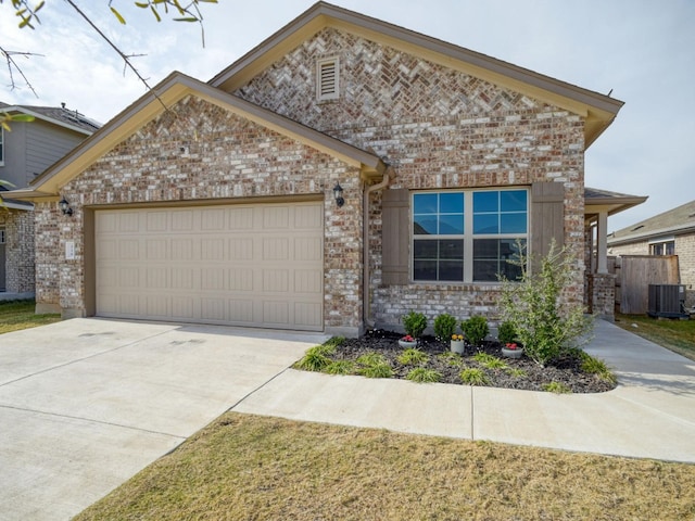 view of front of home with brick siding, concrete driveway, central AC unit, and a garage