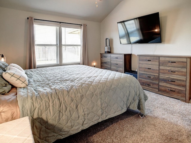 carpeted bedroom with vaulted ceiling