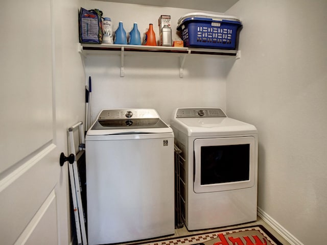 washroom featuring washer and clothes dryer