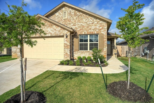 116 Shagbark Dr, Bastrop, TX 78602 - view of front of house with driveway, an attached garage, brick siding, and central AC unit