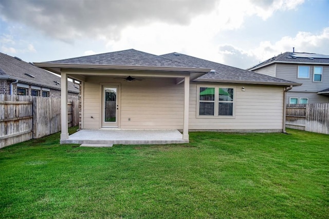 116 Shagbark Dr, Bastrop, TX 78602 - back of house with a patio area, a ceiling fan, and roof with shingles