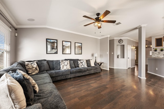 living room with dark hardwood / wood-style flooring, ornate columns, ornamental molding, vaulted ceiling, and ceiling fan