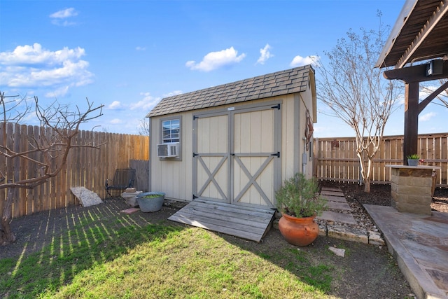 view of outbuilding with cooling unit and a yard