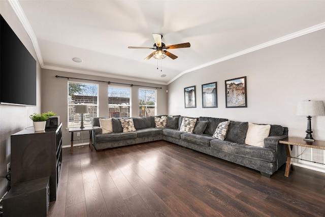 living room featuring ceiling fan, dark hardwood / wood-style floors, crown molding, and vaulted ceiling