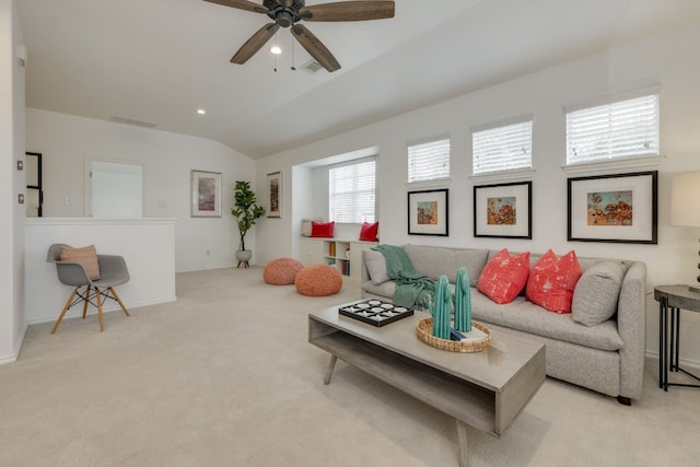 living area with light carpet, lofted ceiling, and ceiling fan