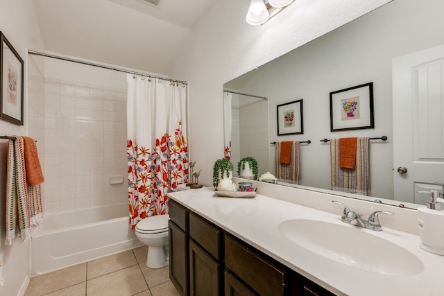 full bathroom featuring lofted ceiling, vanity, shower / bath combination with curtain, tile patterned floors, and toilet