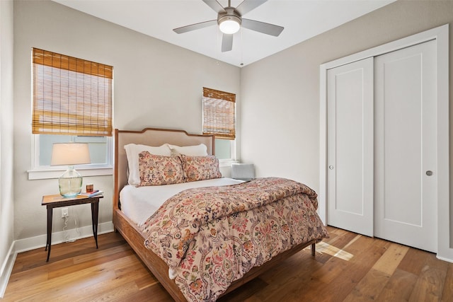 bedroom featuring ceiling fan, a closet, and light hardwood / wood-style floors