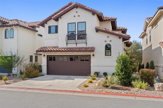 mediterranean / spanish-style home with a garage